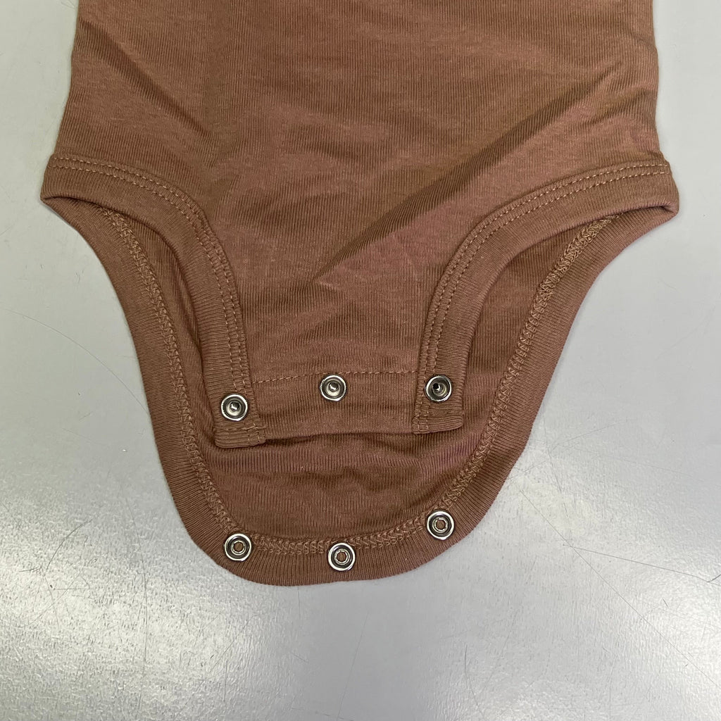Brown baby bodysuit snap closure at bottom with reinforced seams.