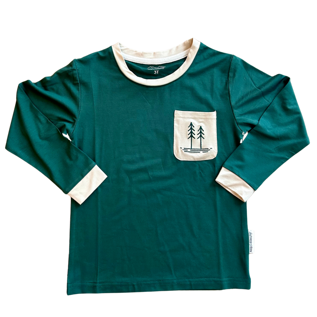 Green bamboo long-sleeve shirt with cream-trim pocket and tree scene graphic