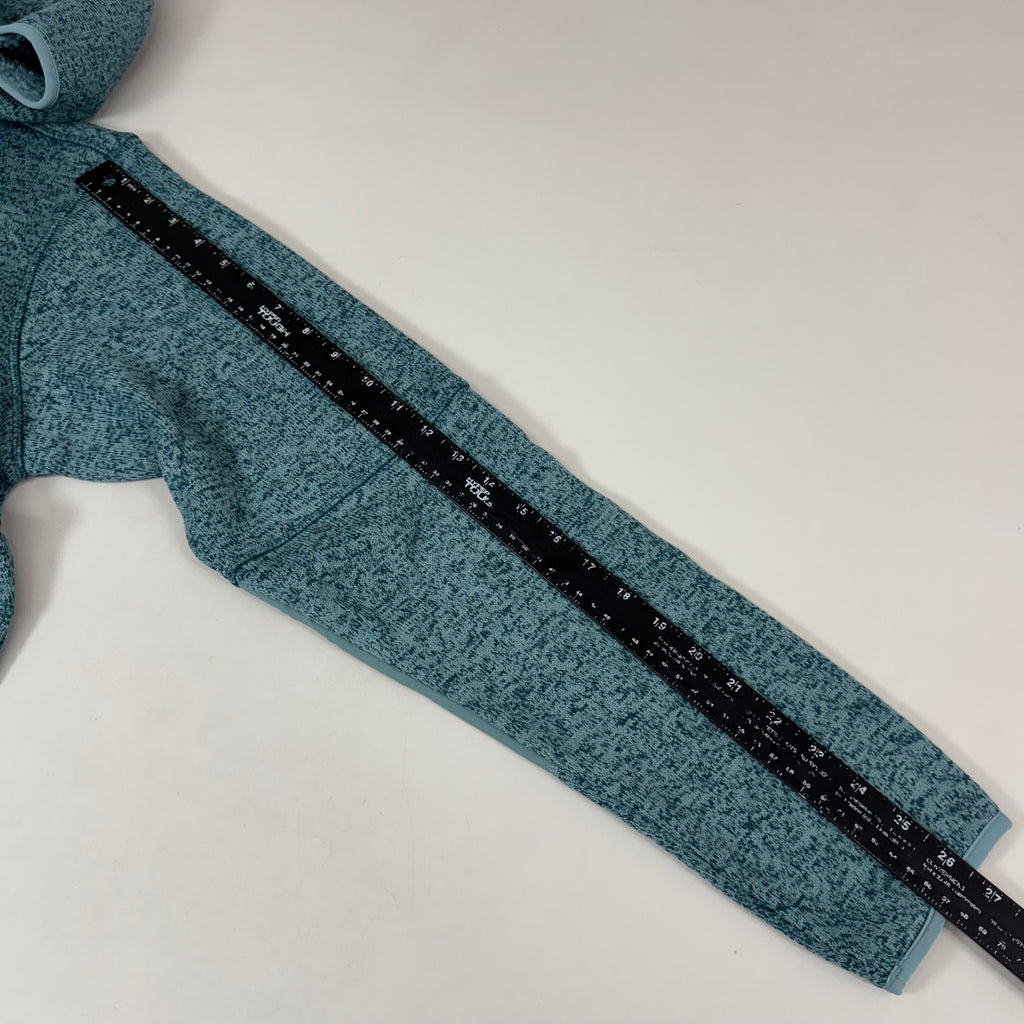 Teal heather fleece jacket close-up of contrast zipper tape with printed markings