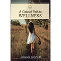 Paperback book cover with woman walking in field, "Wellness" title