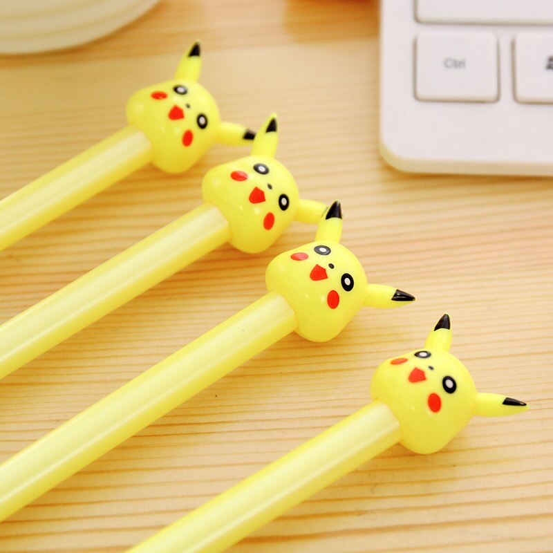 Yellow Pikachu-head gel pens aligned on a desk, black ink writing tips