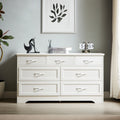 White dresser chest with drawers and chrome metal bar pulls, styled top