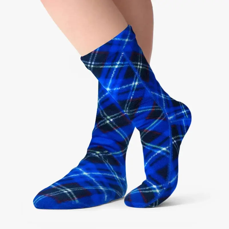 Blue argyle fleece crew socks worn, showing full pattern on foot.