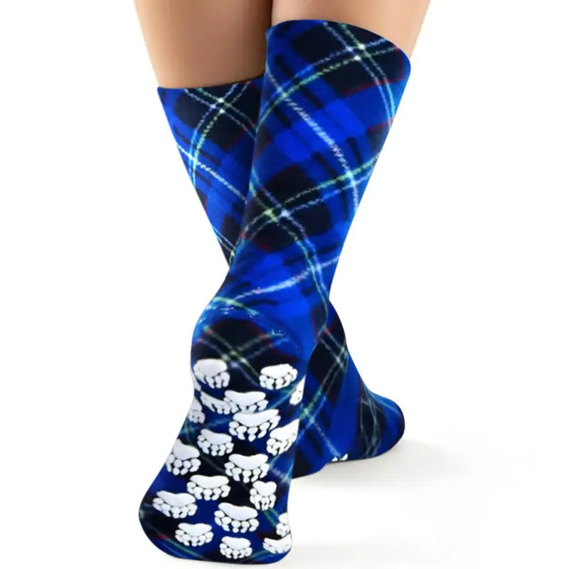 Blue argyle fleece crew socks with white paw-print nonskid sole.