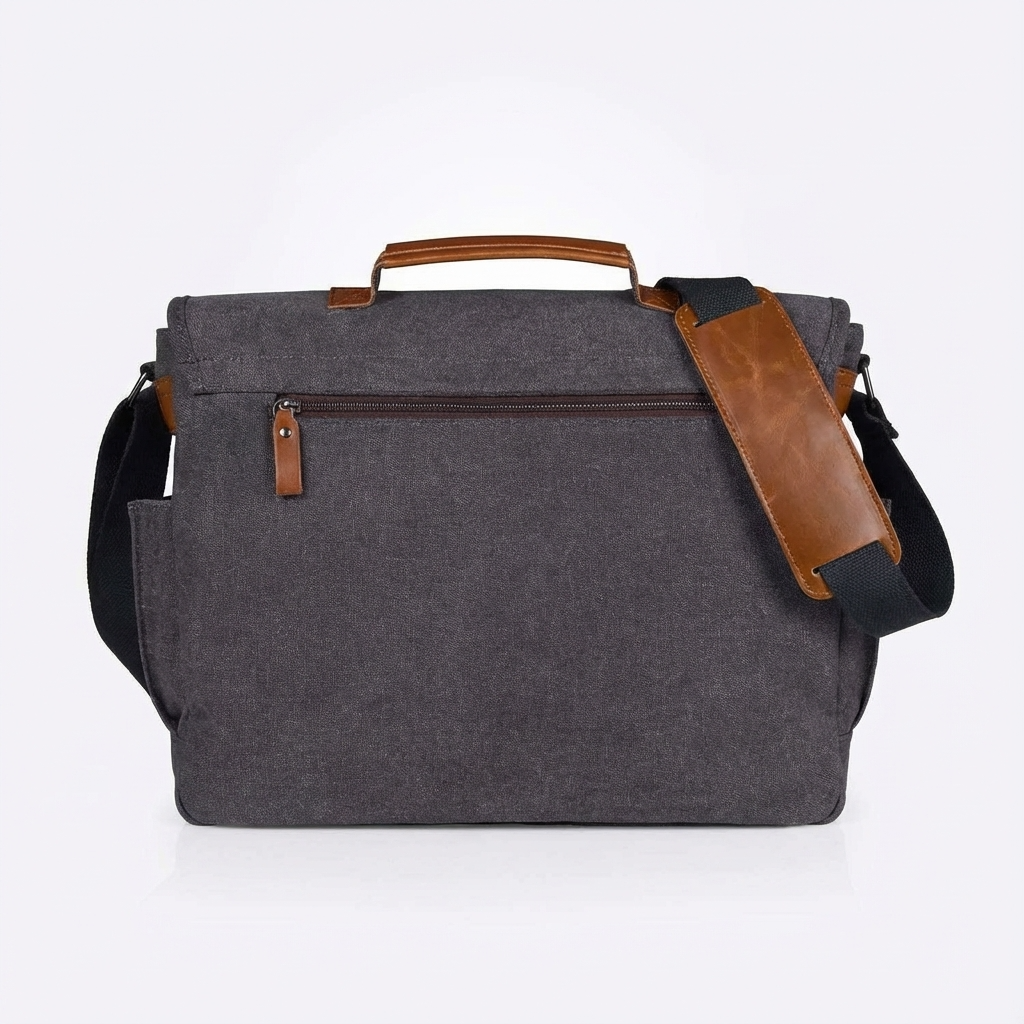 Gray canvas messenger bag with brown leather side strap and back panel