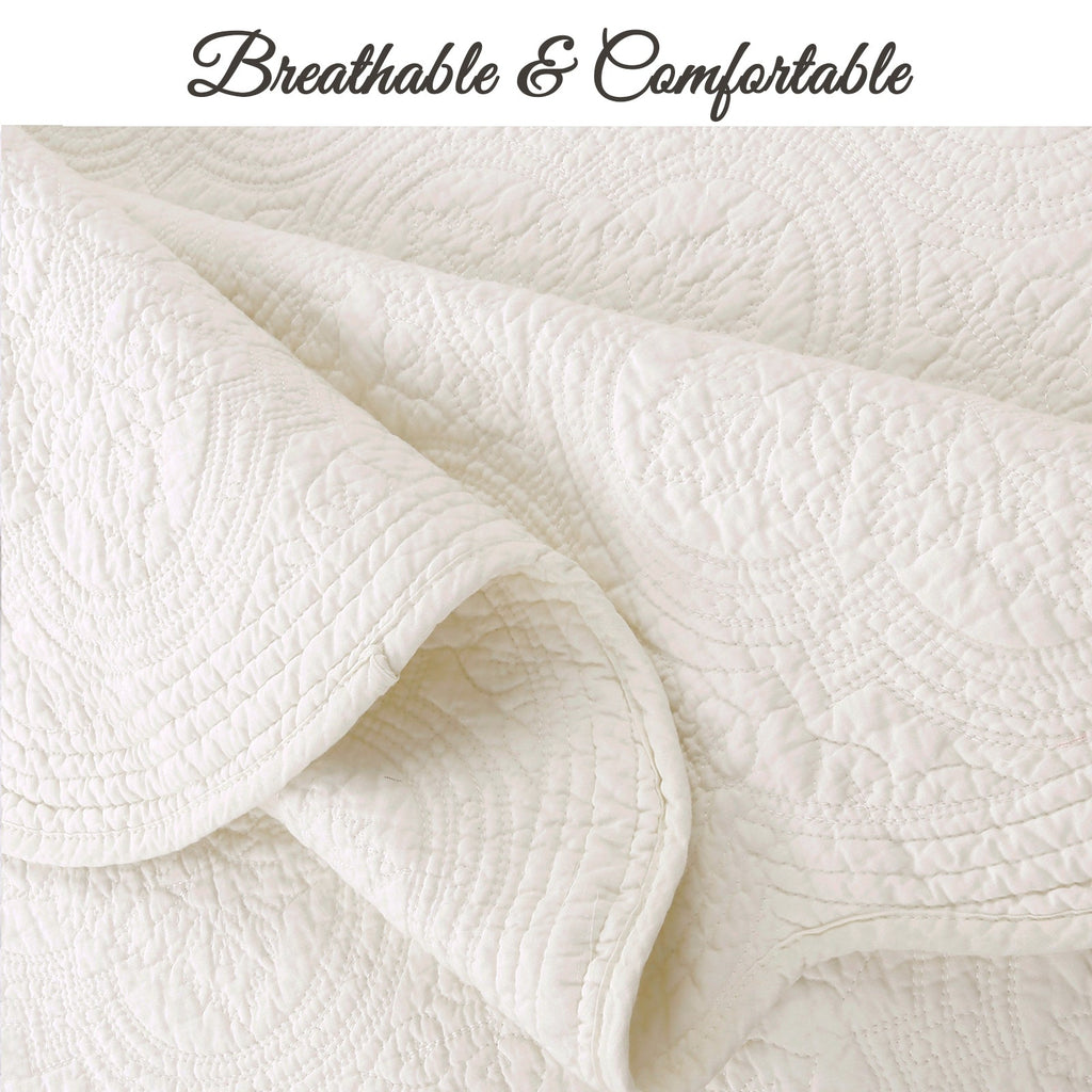 Ivory quilt corner with breathable-looking quilted texture and stitched fabric edge