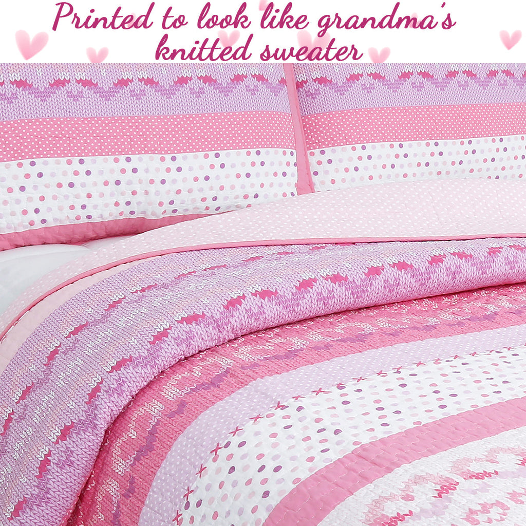 Pink reversible quilt print with ribbed stripe design and knit-sweater zigzag bands