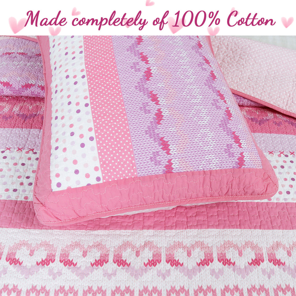 Pink and white reversible quilt with zigzag knit-like stripes and stitched border