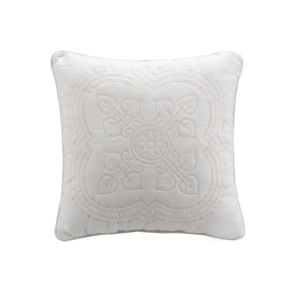 White decorative pillow with ornate stitched medallion design