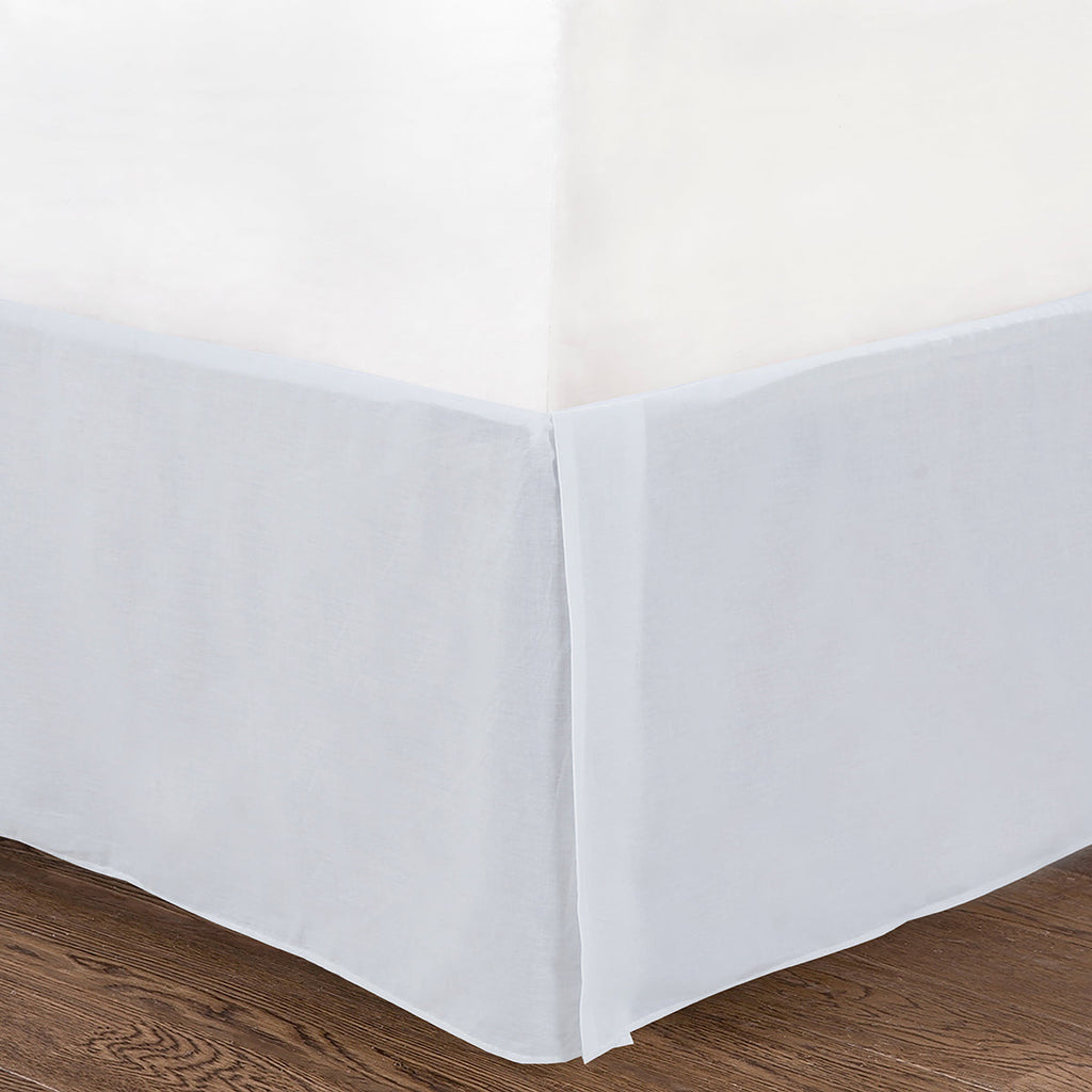 White quilted daybed cover with tailored corner drape