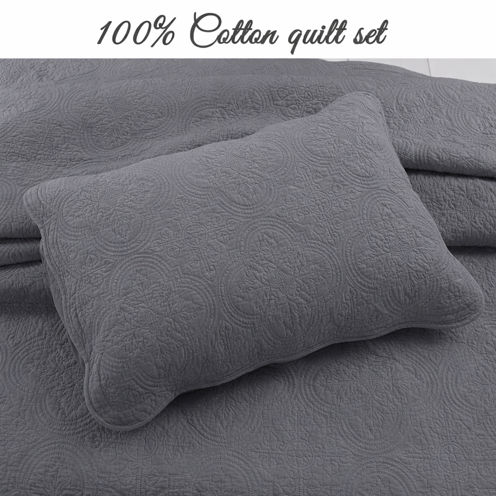 Gray quilt cover and matching pillow with medallion quilted pattern, solid reversible look