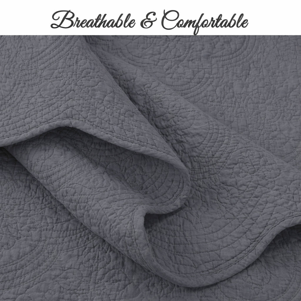 Gray quilt with layered baffle quilting and soft, textured comforter stitching