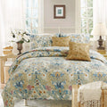 Reversible floral quilt set in blue and tan with matching pillow shams