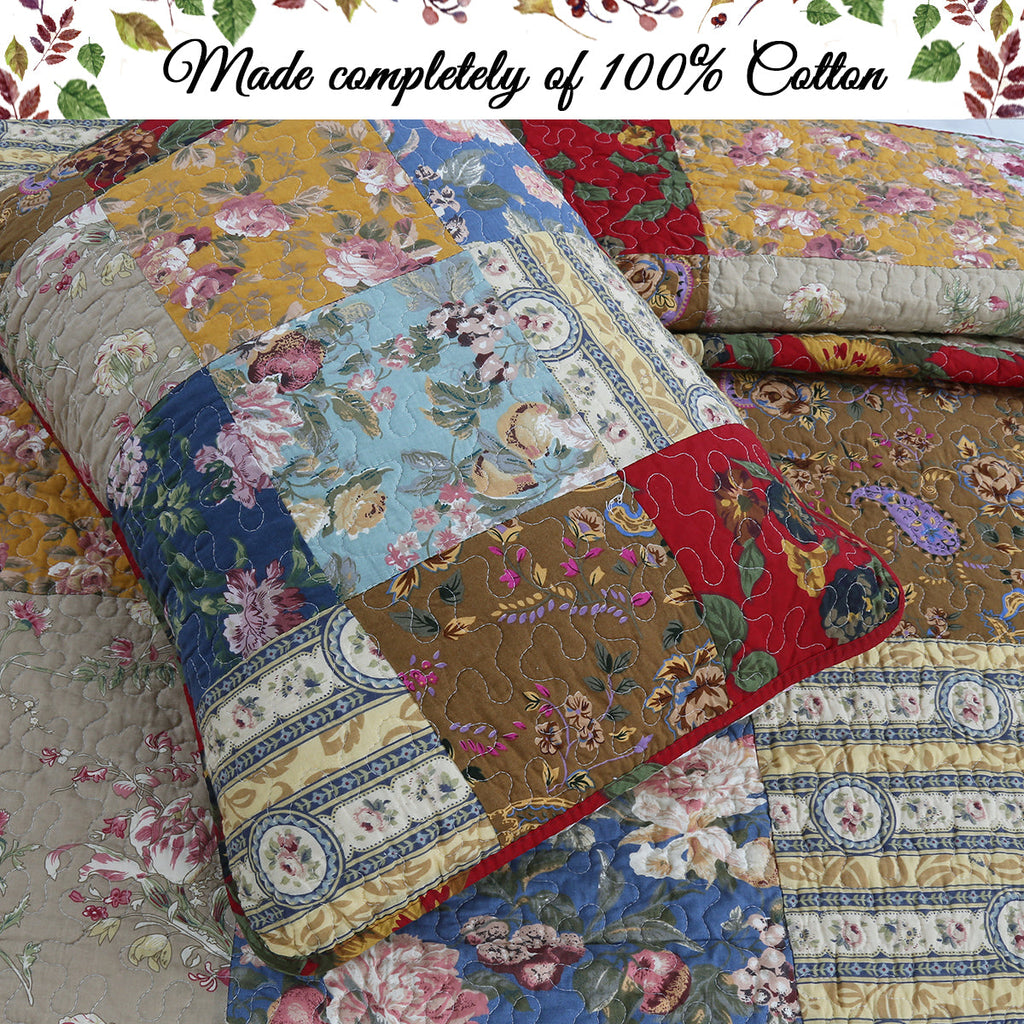 Floral patchwork reversible quilt, close-up of multicolor fabric squares and borders