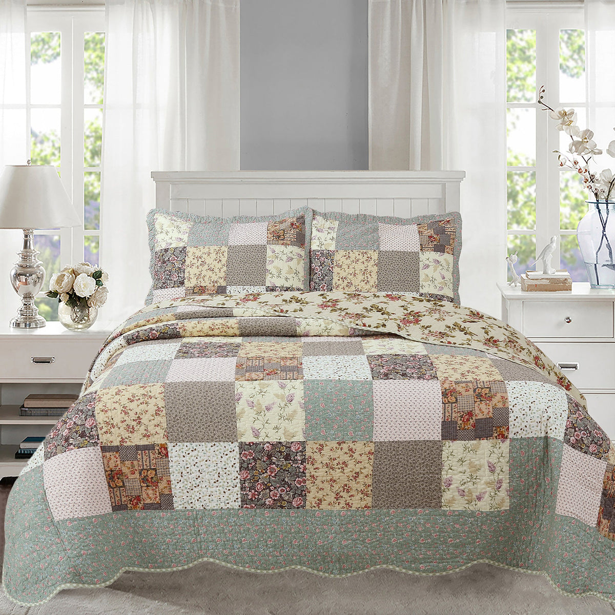 Reversible patchwork quilt with floral patch blocks in teal, cream, and tan, plus pillow shams