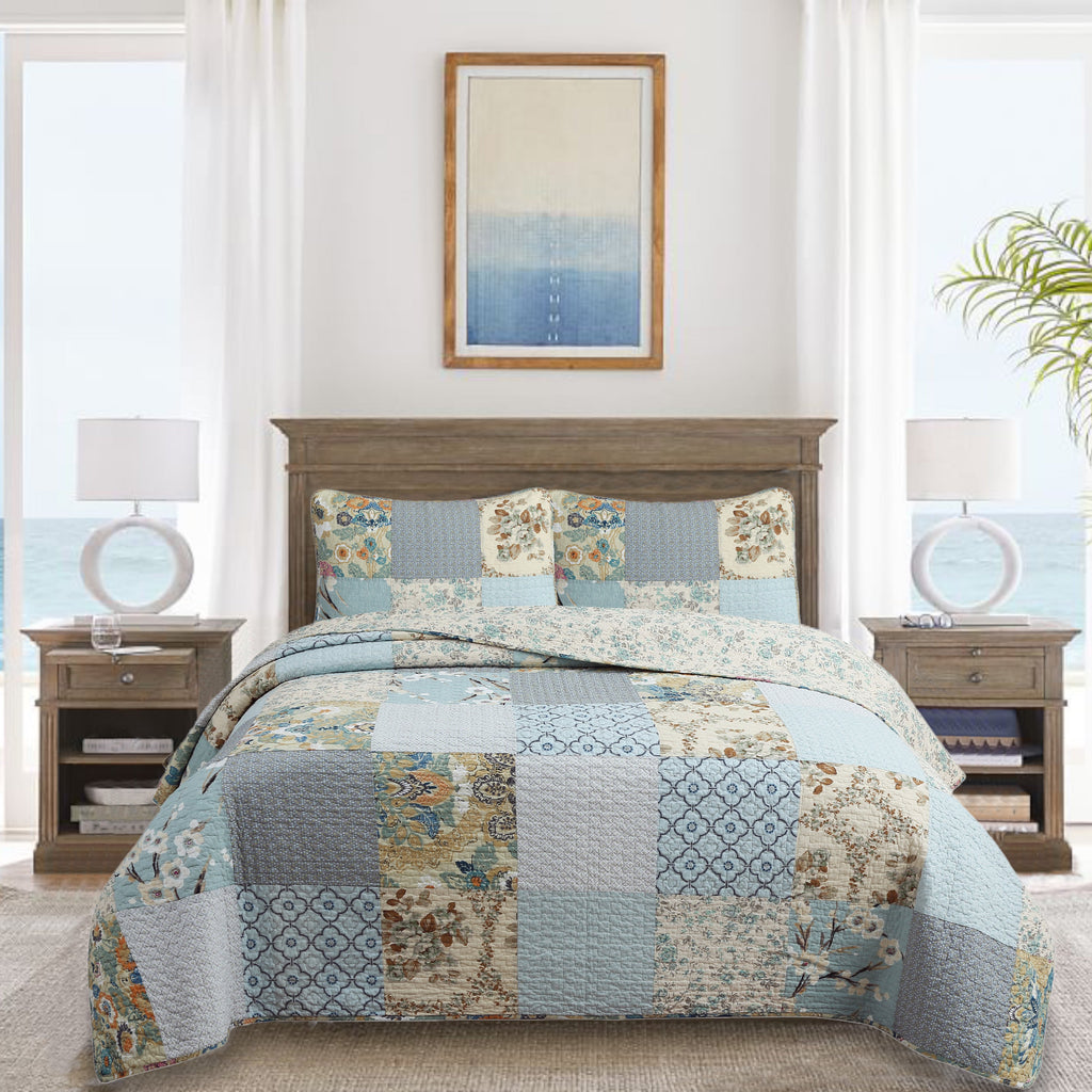 Floral patchwork quilt bedding set in sky blue with matching shams and multicolor squares