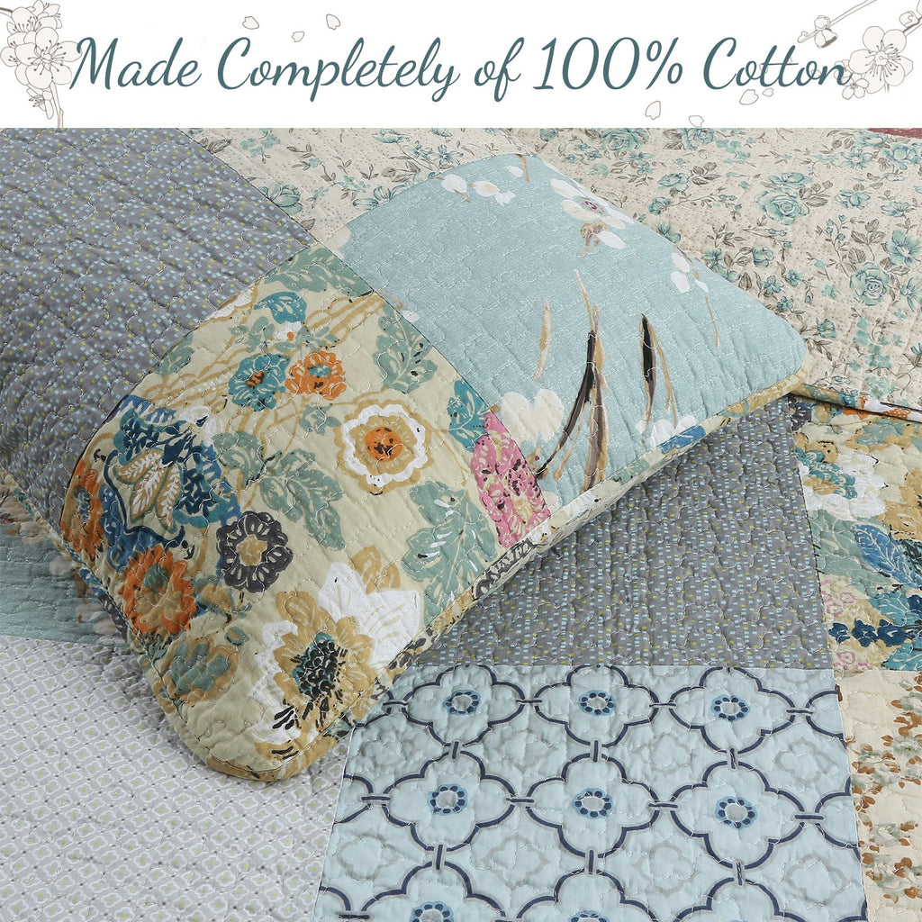 Reversible quilt close-up with light blue floral patches and geometric stitched blocks