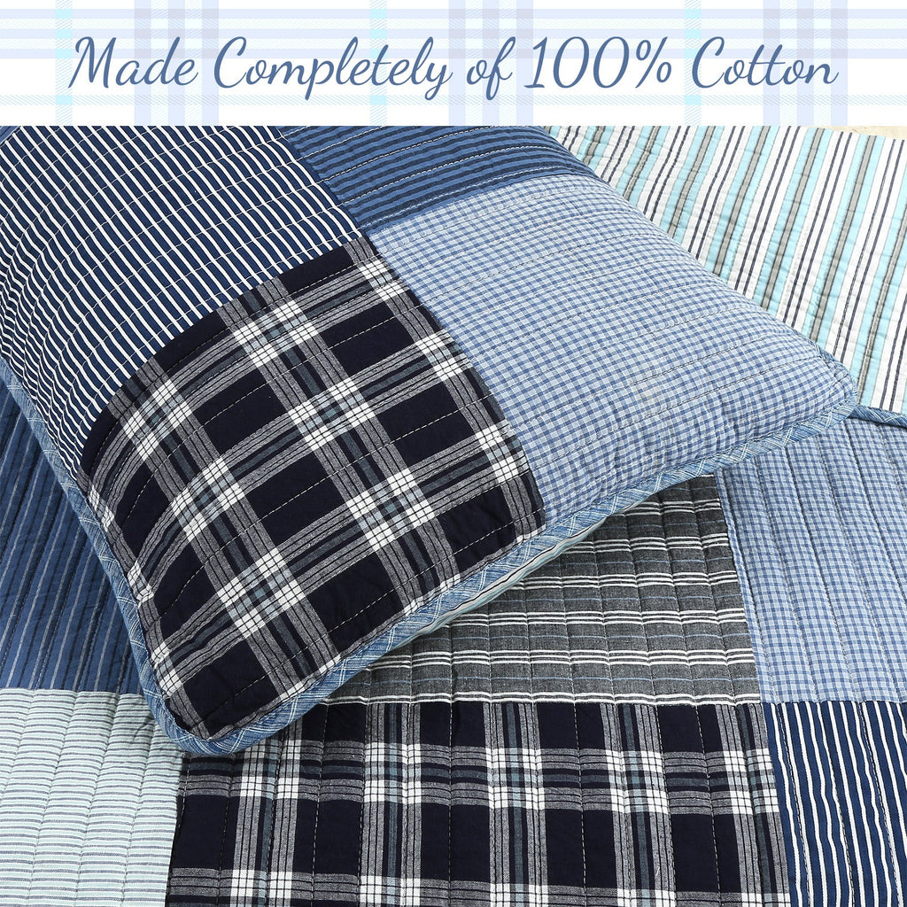 Reversible quilt bedding close-up with blue grid stripes and black plaid panel