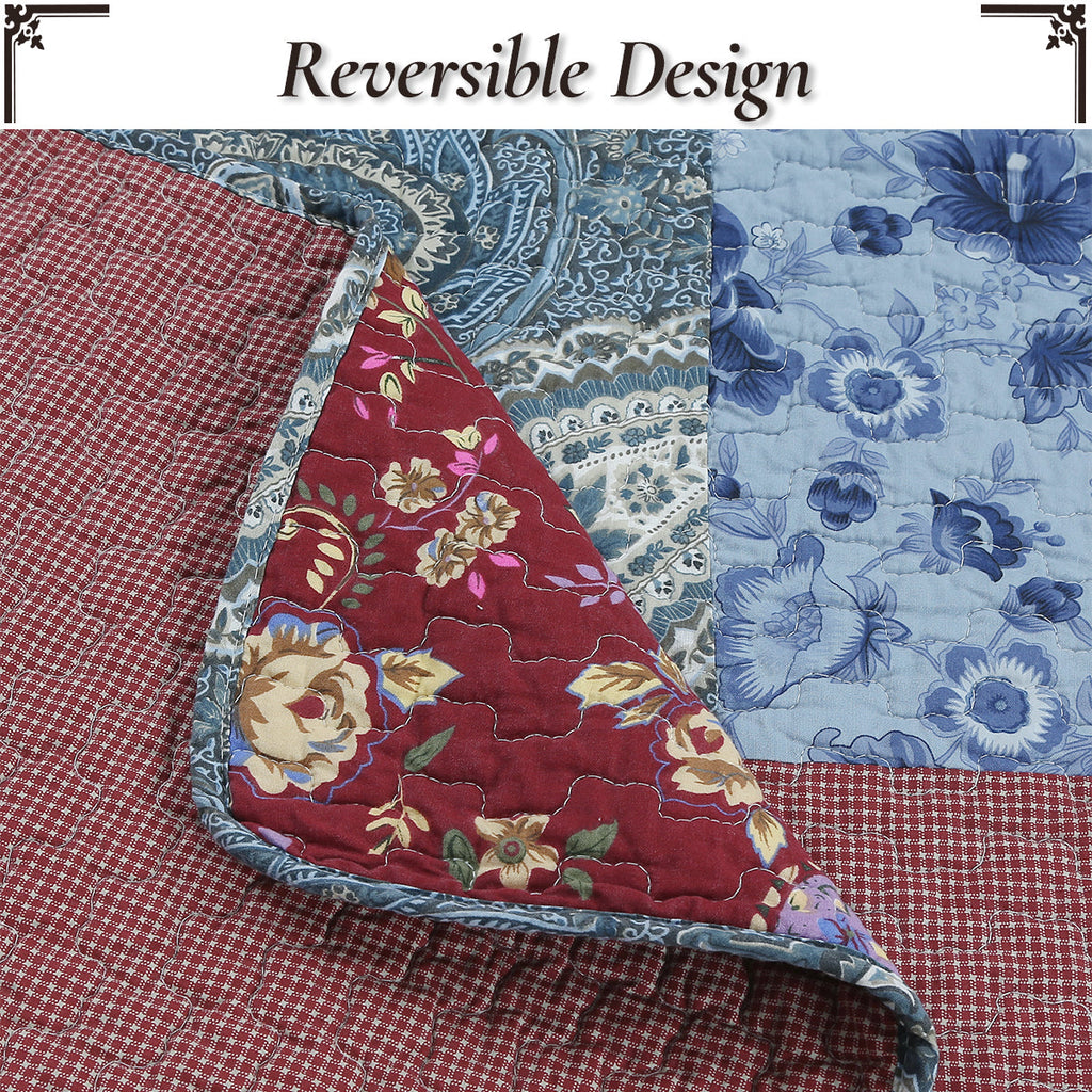 Reversible patchwork quilt with burgundy floral panel and blue floral print sections