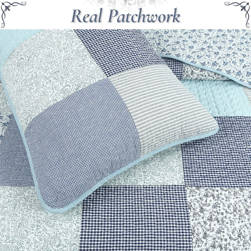 Close-up patchwork quilt with blue and white checkered, gingham, and floral fabric squares