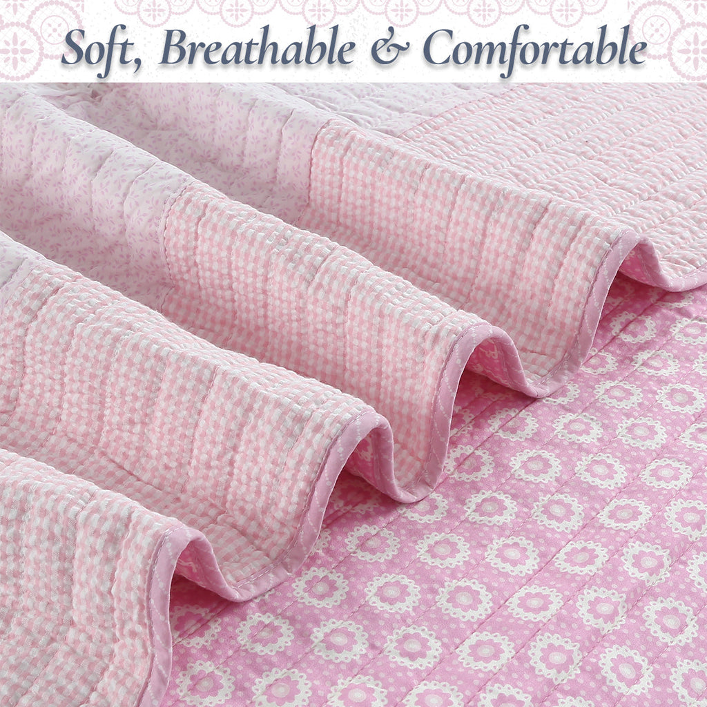 Soft cotton quilt with pink check texture and floral fabric at the seam