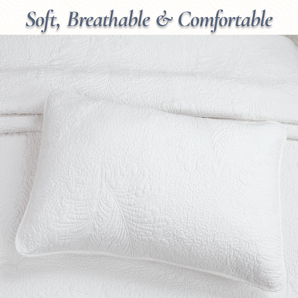 White quilted pillow with raised palm leaf stitching detail, solid color