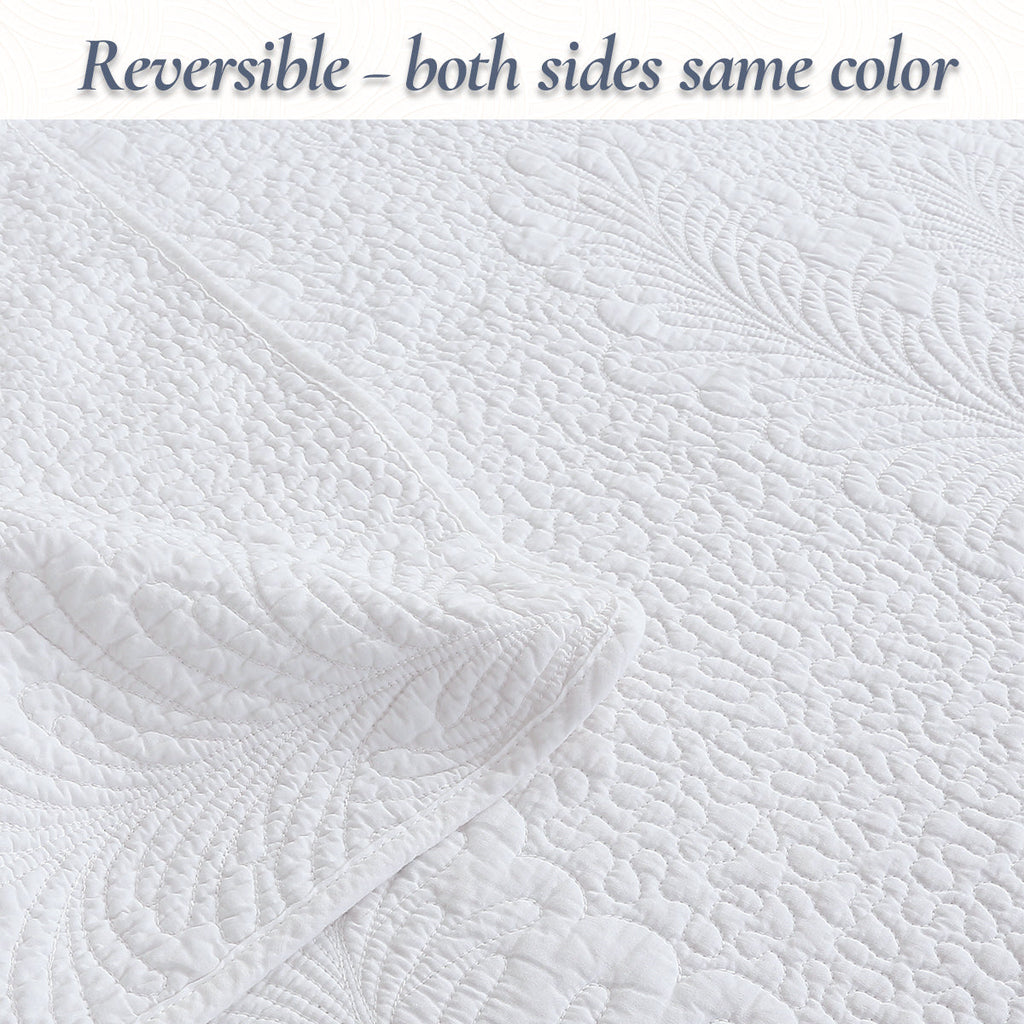 White reversible quilt with matching palm leaf quilting on both sides