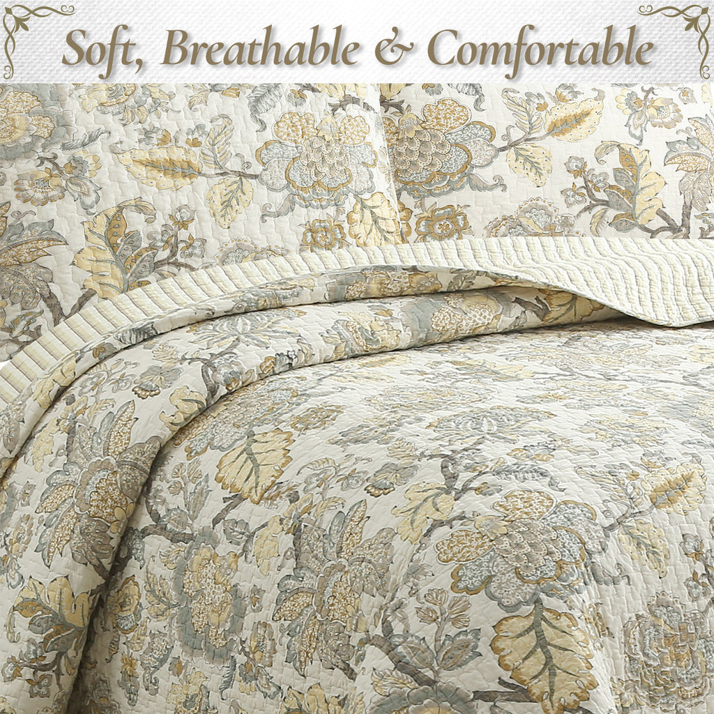 Floral quilt bedding with cream base and gold detail; quilted texture and stitched edge