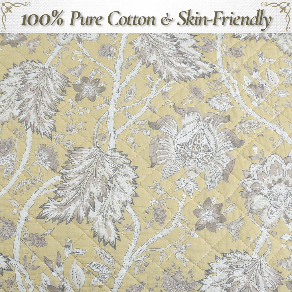 Cotton quilt top in light yellow with white-gray floral and vine pattern