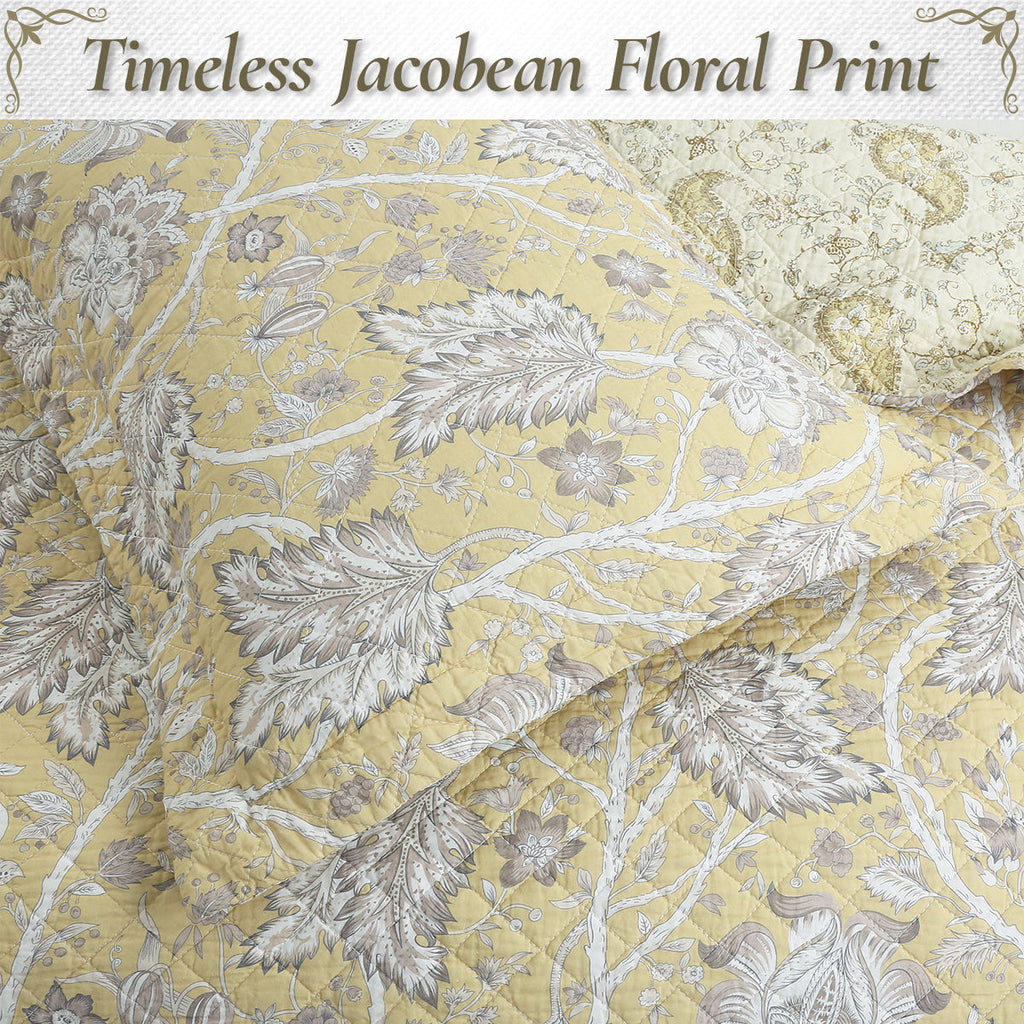 Light yellow cotton quilt with detailed gray leaf and flower floral pattern