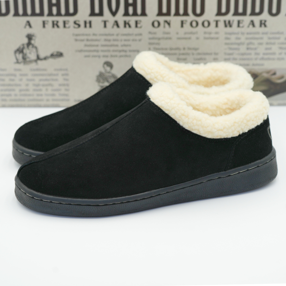 Men's black suede slipper with cream sherpa lining and slip-on side panel