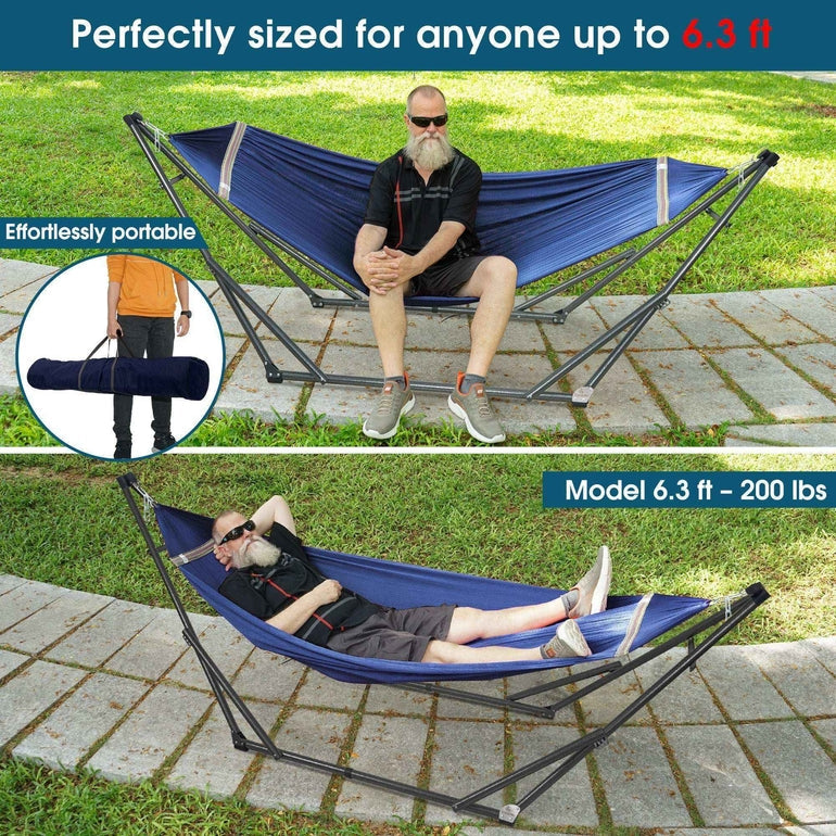 Blue collapsible hammock on stand outdoors, with one person lying inside.