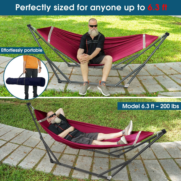 Red collapsible hammock with stand outdoors, with one person lounging