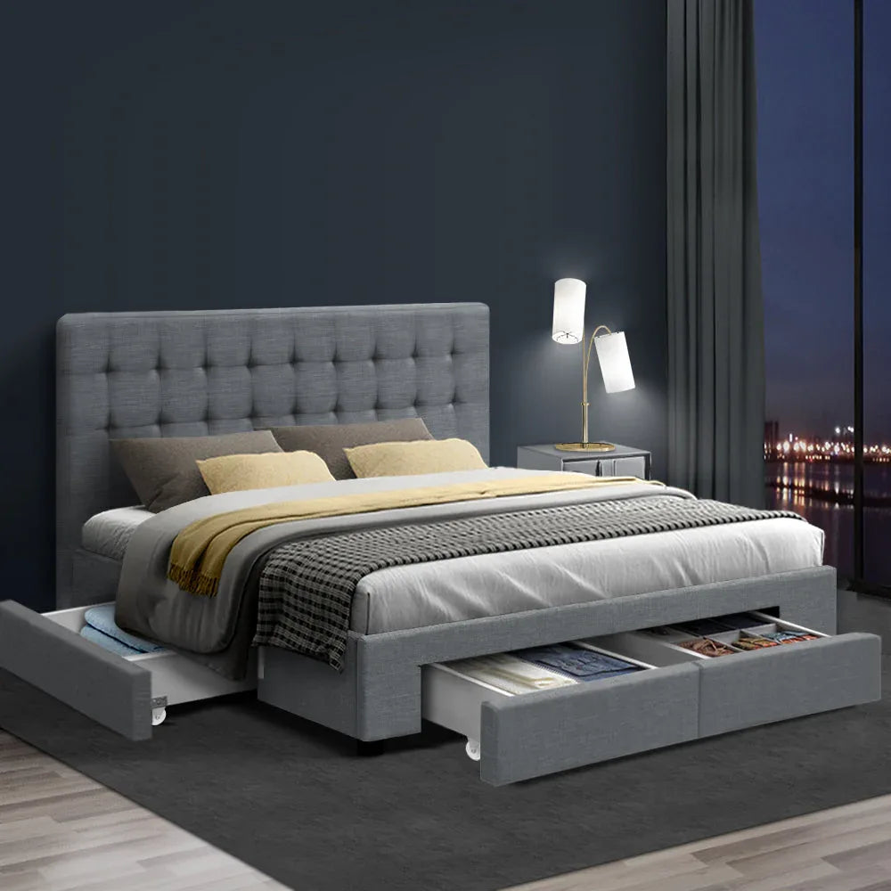 Grey king bed frame with tufted headboard, front drawers, and upholstered side rails