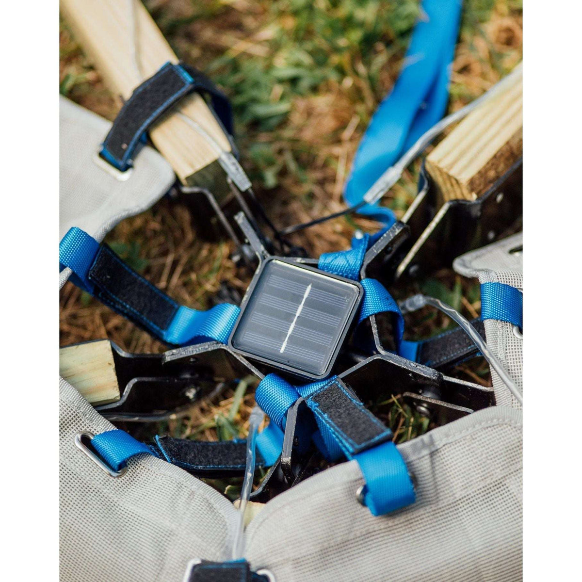 Solar light controller and straps in outdoor tent fabric for mounting