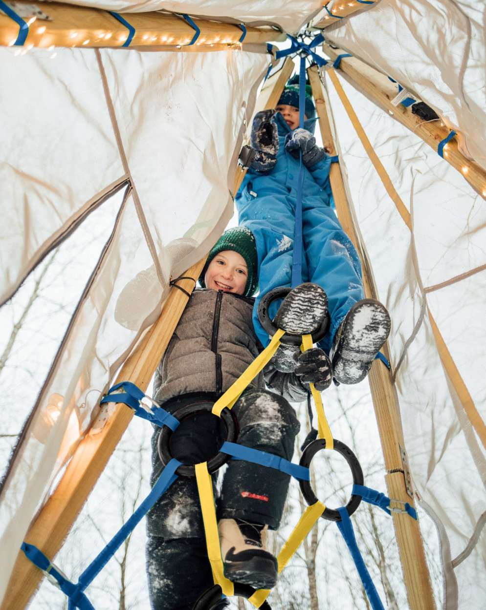 Children inside a teepee with solar string lights and warm LED glow