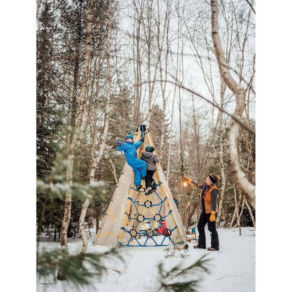 Canvas play tent with blue rope ring climber outdoors in winter