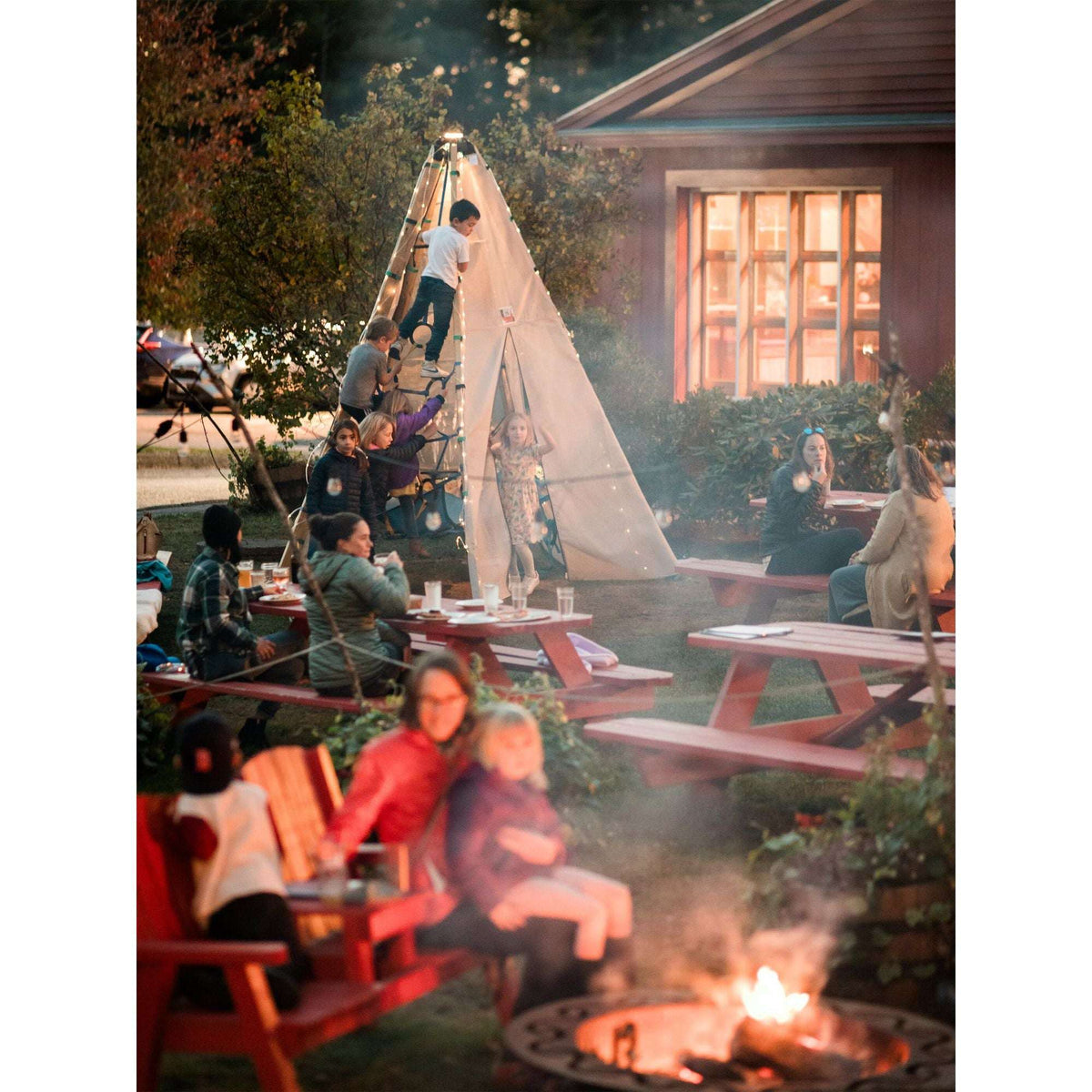 Canvas teepee tent with wood poles and blue rope ties, open front flap