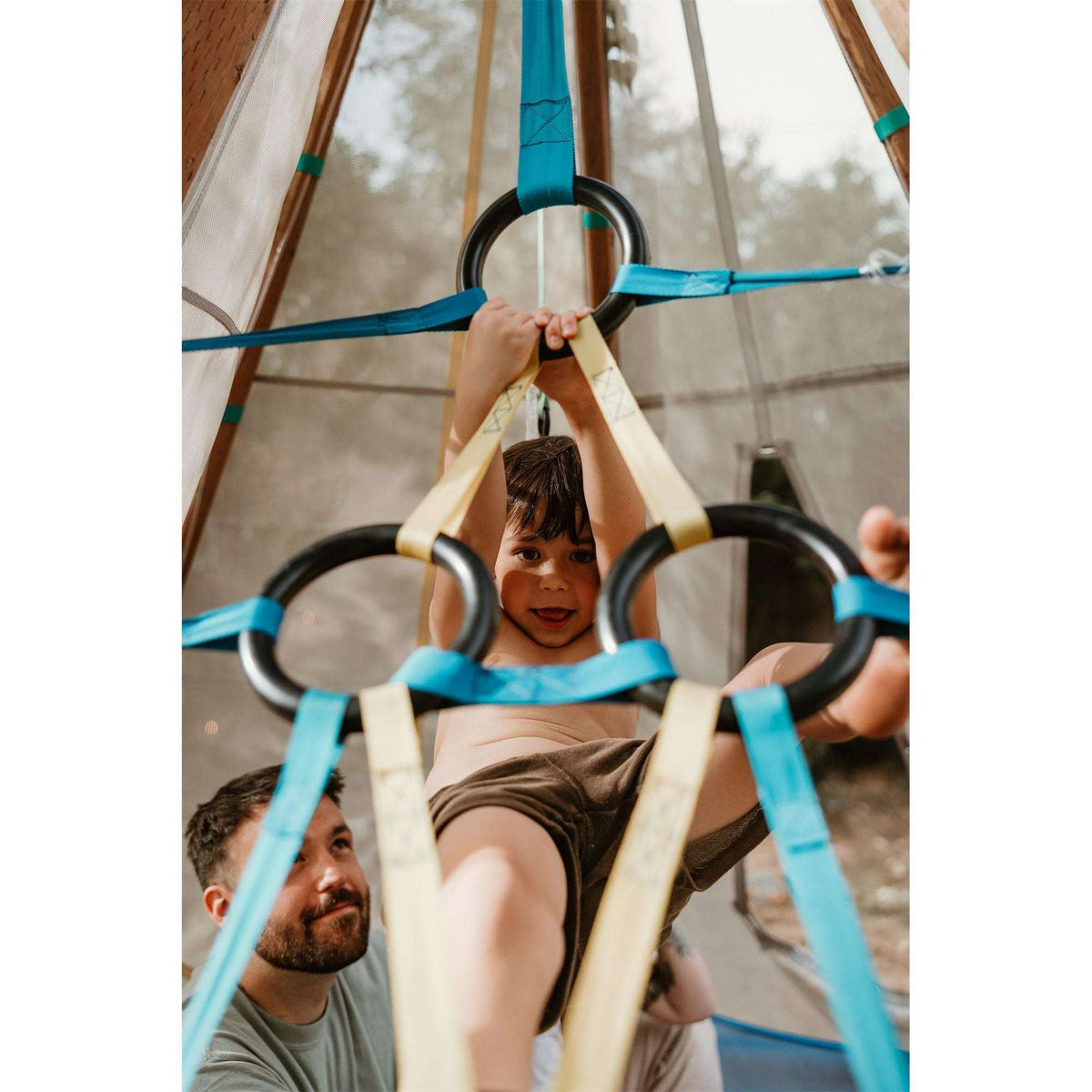 Close-up of blue ring climber inside canvas play tent