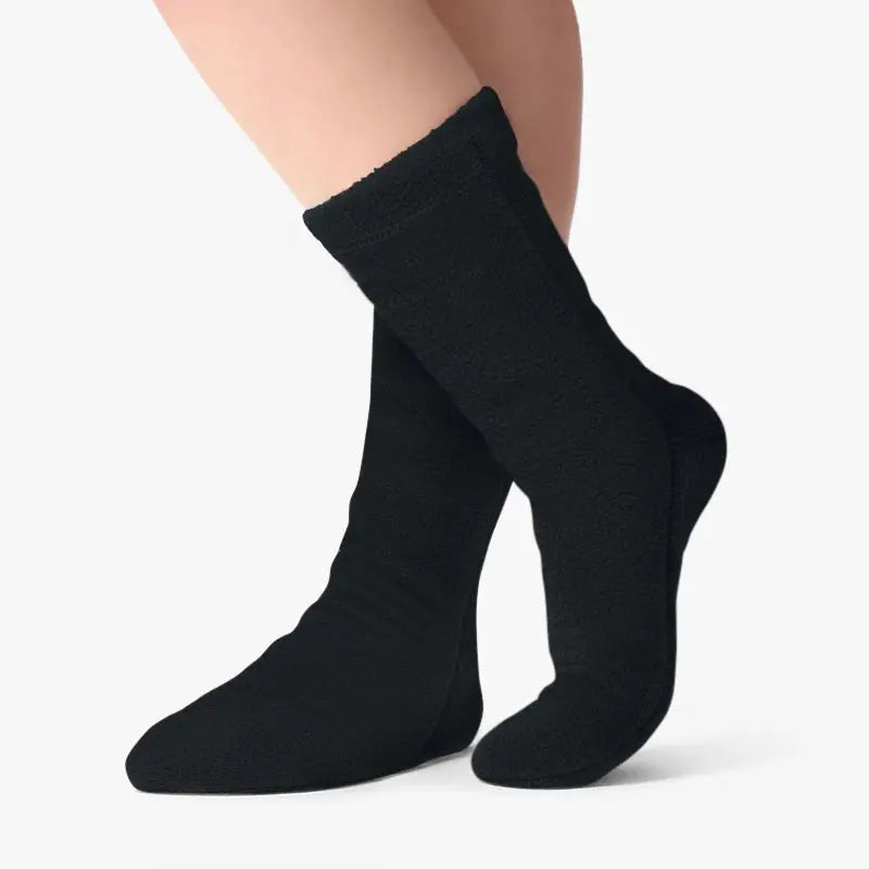 Black fleece crew socks on legs, snug fit at the ankle