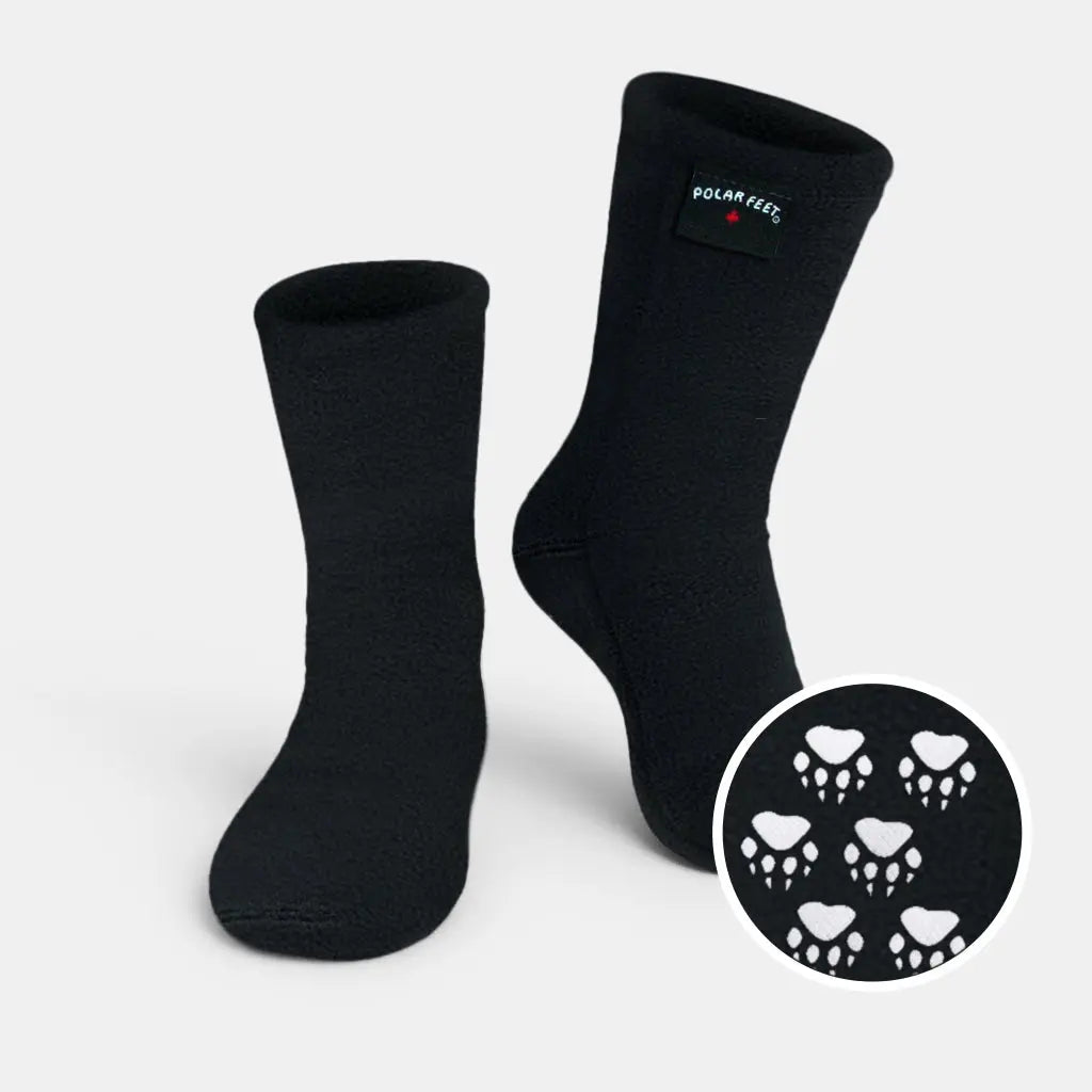 Black crew fleece socks with Polar Feet logo and small skull pattern patch
