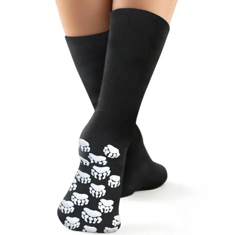 Black crew fleece socks with white skull print across the foot