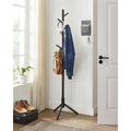 Black standing coat rack with 8 hooks and hanging jackets and bags