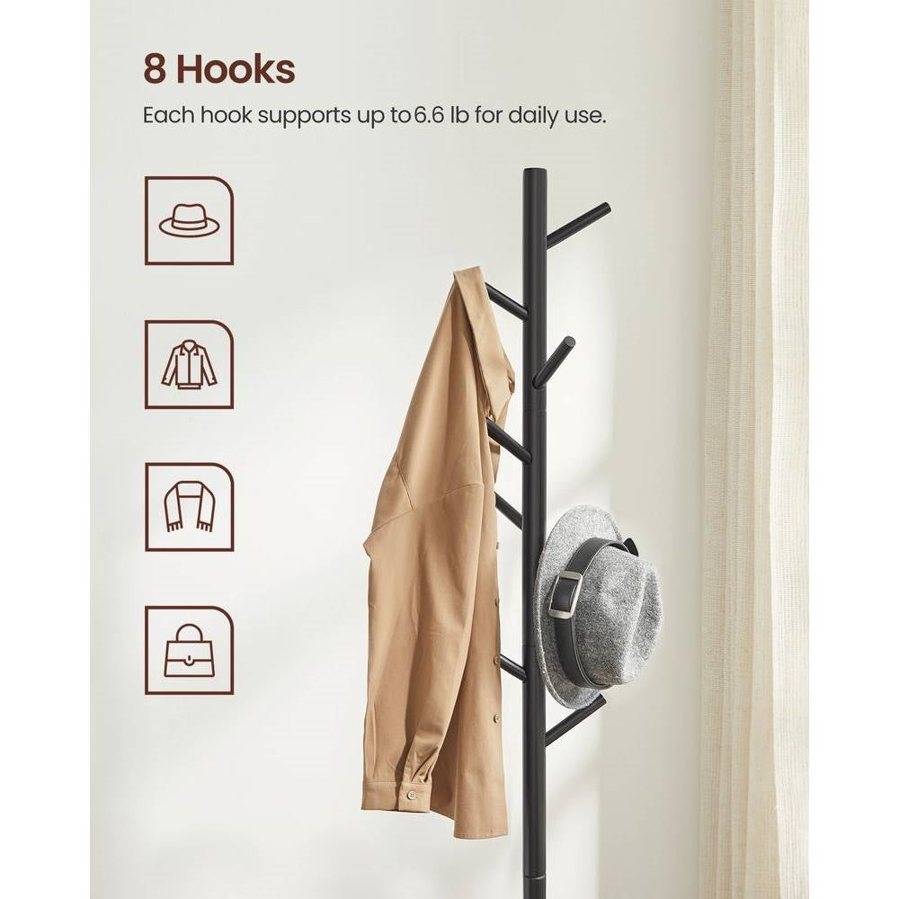 Black coat rack pole with multiple hooks holding a jacket, shirt, and bag