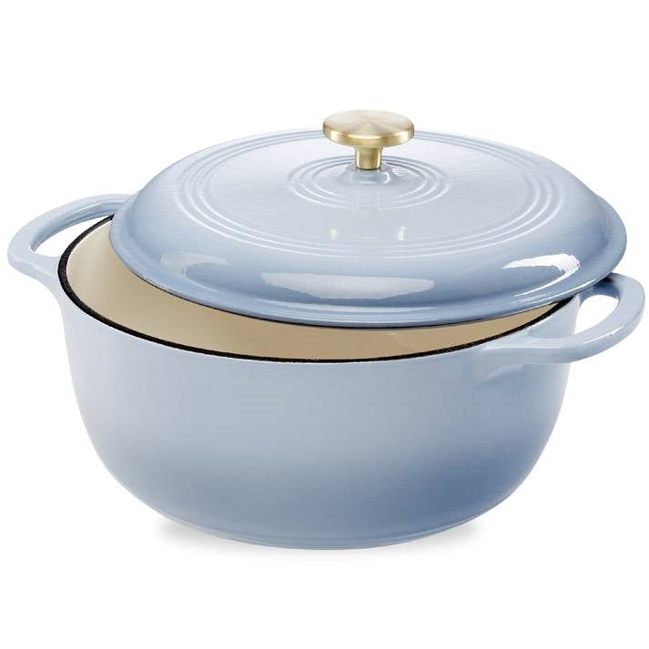 Light blue enamel cast-iron Dutch oven with gold knob lid and side handles