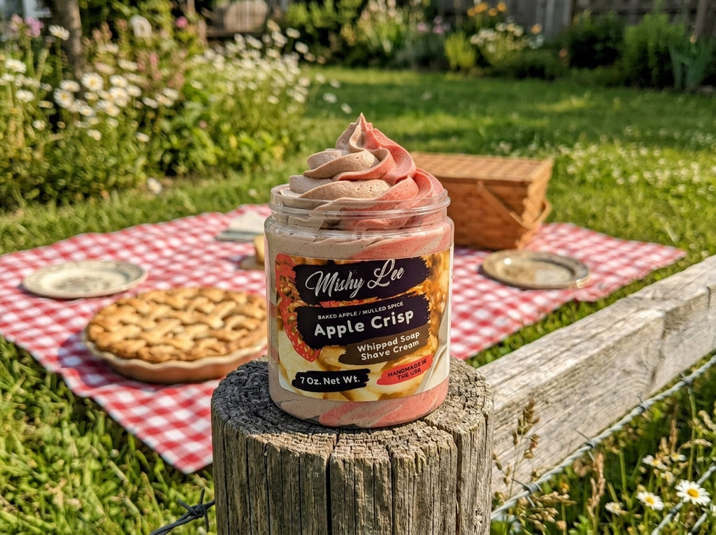 Whipped soap and shave cream jar on outdoor table with pink-brown swirls