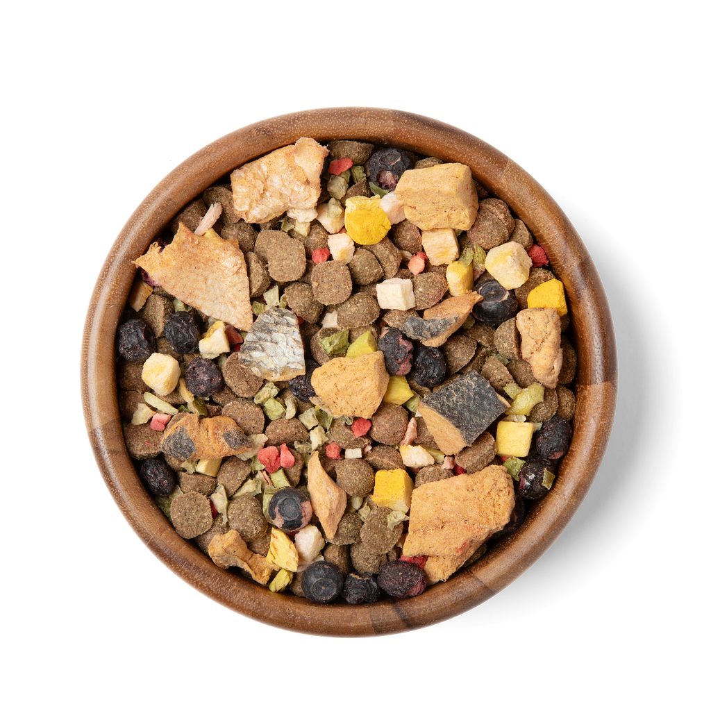 Bowl of freeze-dried trail mix topper with mixed crunchy bites in a wood bowl