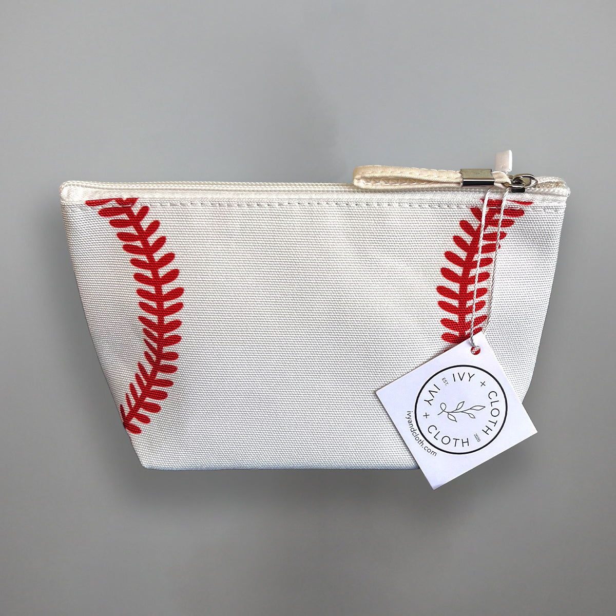 Baseball pouch with red baseball seam print and zip top