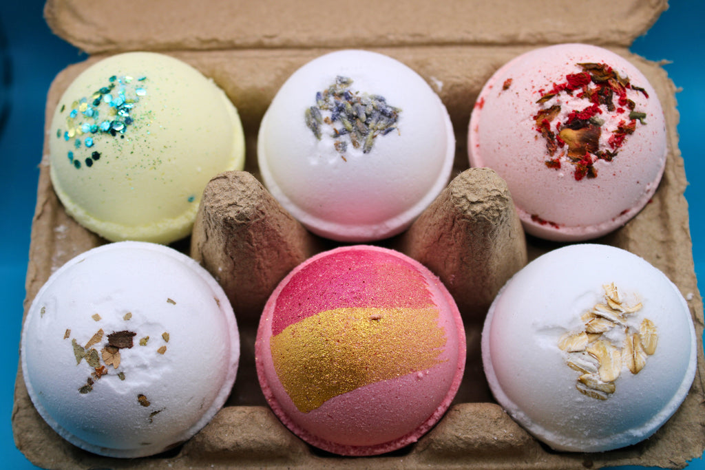 Mini bath bomb bundle in tray showing six colorful bath bombs with glitter center