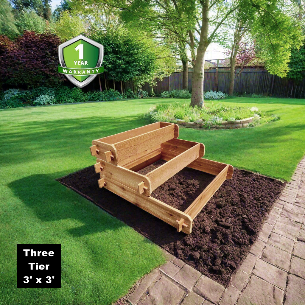 Three-tier raised cedar garden bed planter with three soil sections on a lawn path edge